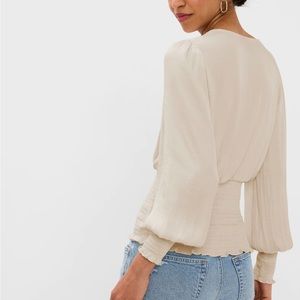 New with tags. Flattering smocked wrap Top